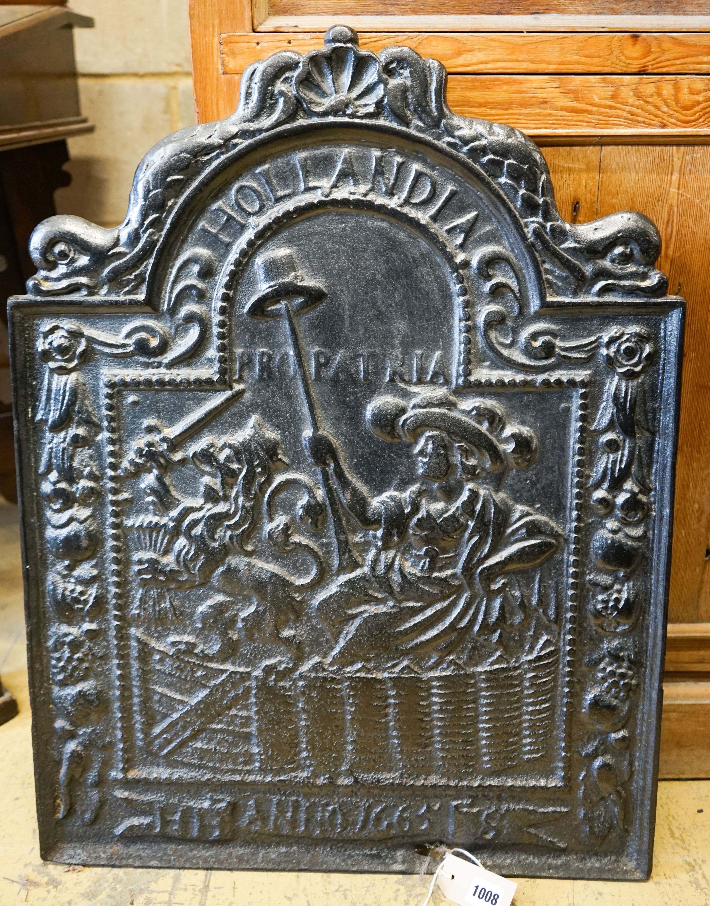 A cast iron fireback inscribed 